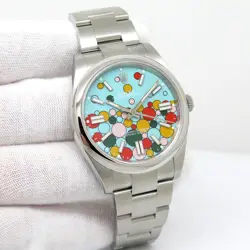 ROLEX 124300 OYSTER PERPETUAL 41 WITH TURQUOISE CELEBRATION MOTIF DIAL
