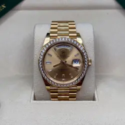 ROLEX DAY-DATE 40 CHAMPAGNE BAGUETTE DIAMOND 18K GOLD DIAMOND BEZEL PRESIDENT