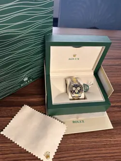 ROLEX OYSTER PERPETUAL 1005 GOLD OYSTER BRACELET WITH BLACK BEZEL