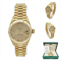 LADIES ROLEX 26MM PRESIDENTIAL 18K GOLD WATCH W/CHAMPAGNE DIAL AND FLUTED BEZEL.