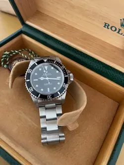 ROLEX SUBMARINER 14060M WITH ORIGINAL BOX AND PAPERS
