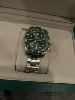 ROLEX SUBMARINER 116610LV SILVER OYSTER BRACELET WITH GREEN BEZEL