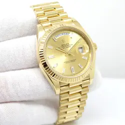 ROLEX 228238 DAY DATE 40 18K YELLOW GOLD WITH CHAMPAGNE BAGUETTE DIAMOND DIAL