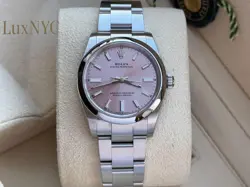 NEW UNWORN ROLEX OYSTER PERPETUAL 34MM LADIES PINK DIAL MODEL 124200. WARRANTY!