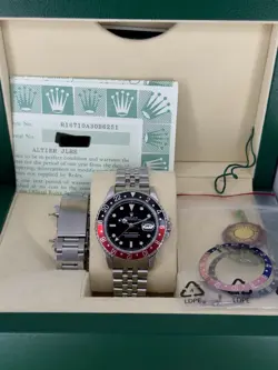 ROLEX GMT-MASTER II 16710 JUBILEE/OYSTER. BOX AND PAPERS. E SERIAL. 3 INSERTS.