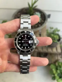 2007 ROLEX SUBMARINER 16610 SILVER OYSTER BRACELET WITH BLACK BEZEL