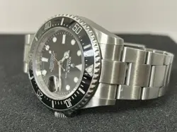 ROLEX SEA-DWELLER 126600 SILVER OYSTER BRACELET WITH BLACK BEZEL