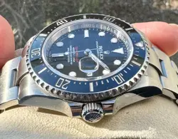 ROLEX SEA-DWELLER 126600 SILVER OYSTER BRACELET WITH BLACK BEZEL