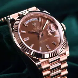 ROLEX DAY-DATE 40 CHOCOLATE BROWN BAGUETTE DIAL ROSE GOLD MINT FULL SET 228235