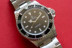 2007 ROLEX SUBMARINER 14060 M WITH BOX AND PAPERS
