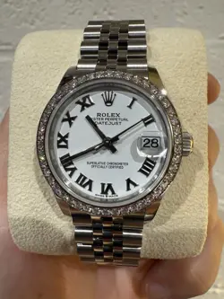 **NEW** ROLEX 31MM DATEJUST (2024) WHITE ROMAN DIAL W/DIAMOND BEZEL. CROWN CLASP