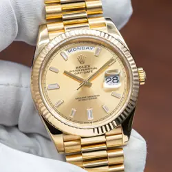 ROLEX DAY-DATE 40 CHAMPAGNE BAGUETTE DIAL YELLOW GOLD 228238