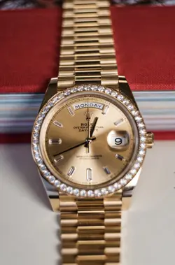 ROLEX DAY-DATE 40MM REF: 228348RBR , 18K YG BAGUETTE DIAMOND DIAL AND BEZEL