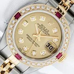 ROLEX LADIES DATEJUST CHAMPAGNE DIAMOND WATCH WITH 18K GOLD RUBY BEZEL 79173