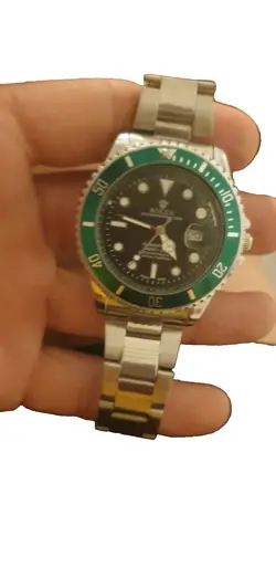 ROLEX SUBMARINER 126610LV SILVER OYSTER BRACELET WITH GREEN