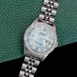 ROLEX DATEJUST LADIES STAINLESS STEEL BLUE MOTHER OF PEARL BAGUETTE WATCH 26MM
