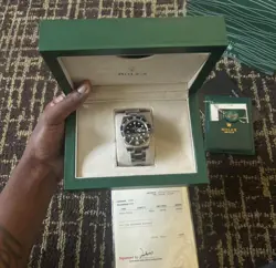 SILVER AND BLACK ROLEX SUBMARINER WITH BOX AND SERVICE PAPERS