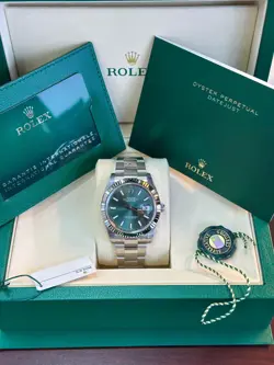 ROLEX  DATEJUST - FLUTED BEZEL - MINT GREEN INDEX DIAL - OYSTER BRACELET.