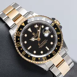 ROLEX GMT-MASTER II 16713 BLACK DIAL TWO-TONE OYSTER BAND 1991 WITH PAPERS