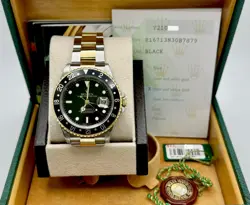 ROLEX GMT MASTER II 16713 40MM BLACK DIAL 18K YELLOW GOLD STEEL BOX PAPER 2002