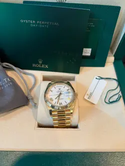 ROLEX DAY-DATE PRESIDENT 40MM 18K GOLD 228238 WHITE ROMAN PERPETUAL OYSTER 2022
