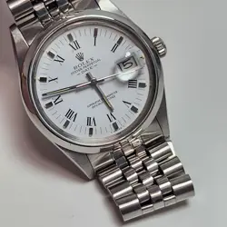 ROLEX DATE 34 MM WHITE ROMAN STEEL JUBILEE AUTOMATIC WATCH 15000 CIRCA 1983