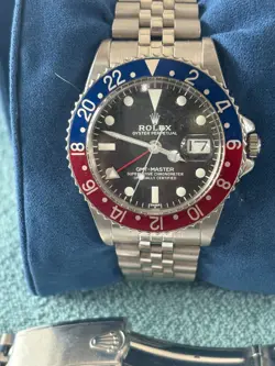 1963 ROLEX GMT-MASTER 1675 SILVER JUBILEE BRACELET WITH BLUE AND RED BEZEL
