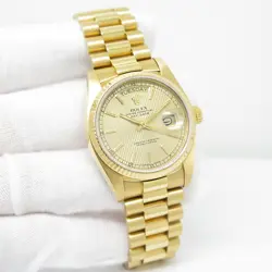 ROLEX 18038 DAY DATE 18K YELLOW GOLD WITH CHAMPAGNE TAPESTRY DIAL