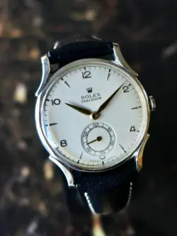 A BEAUTIFUL VINTAGE 1946 MID-SIZE ROLEX PRECISION WATCH WITH FANCY LUGS IN STEEL