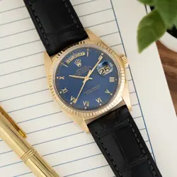 ROLEX DAY-DATE 36 18038, YELLOW GOLD, BLUE ROMAN DIAL, LEATHER STRAP