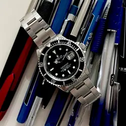 2005-2006 ROLEX SUBMARINER DATE - 16610 - BLACK DIAL WITH BOX & PAPERS