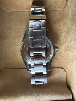 Rolex Submariner R11610A w/calendar black dial boxes certificate, all booklets.