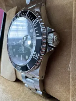 Rolex Submariner R11610A w/calendar black dial boxes certificate, all booklets.