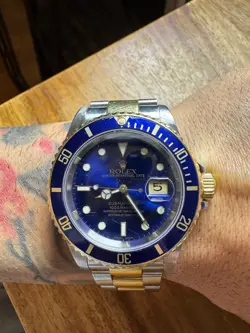 ROLEX SUBMARINER SILVER AND GOLD OYSTER BRACELET WITH BLUE BEZEL