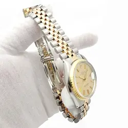 Men's Rolex 34mm Date 18K Gold / Steel Watch with Gold Dial and Fluted Bezel.