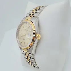 WITH CHAMPAGNE DIAL.