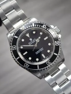 1991 ROLEX SUBMARINER 14060 SILVER OYSTER BRACELET WITH BLACK BEZEL WATCH