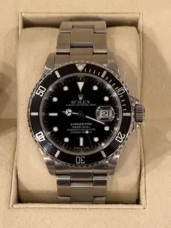ROLEX SUBMARINER 16610 - BLACK DIAL 40MM WATCH - WITH PAPERS