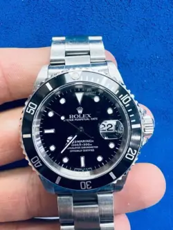 ROLEX SUBMARINER 16610 SILVER OYSTER BRACELET WITH BLACK BEZEL WITH DATE