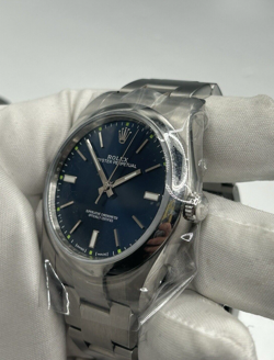 ROLEX OYSTER PERPETUAL 114300 SILVER OYSTER BRACELET, SILVER BEZEL, BLUE DIAL