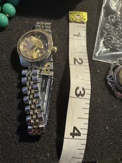 One Ladies Rolex WW Stainless Steel 18KTYG Oyster Perpetual Channel in Diamonds