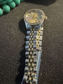 One Ladies Rolex WW Stainless Steel 18KTYG Oyster Perpetual Channel in Diamonds
