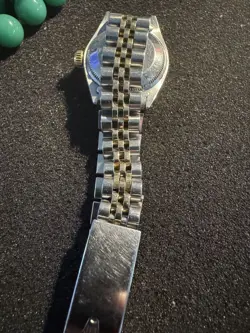 One Ladies Rolex WW Stainless Steel 18KTYG Oyster Perpetual Channel in Diamonds