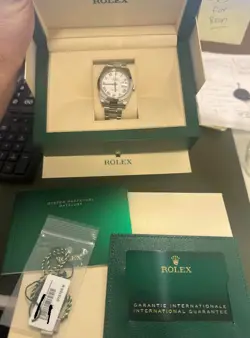 ROLEX DATEJUST 41MM 126300 WHITE ROMAN OYSTER BRACELET WITH SMOOTH BEZEL