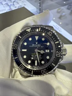 ROLEX SEA-DWELLER 126660 SILVER OYSTER BRACELET WITH BLACK BEZEL