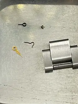 Rolex Parts Tin with parts and link inside