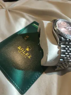 1 OF 1 WOMAN’S ROLEX WATCH