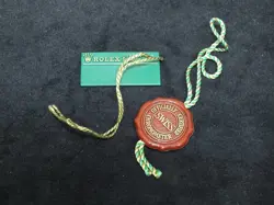 ROLEX GREEN TAG/RED