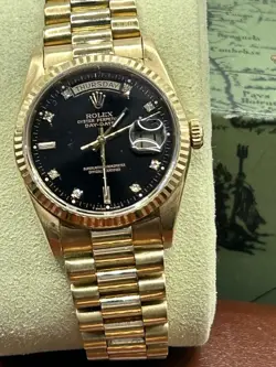 AUTHENTIC ROLEX 18K GOLD DAY-DATE PRESIDENT BLACK DIAMOND DIAL.