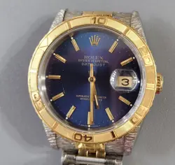 STAINLESS GOLD WATCH